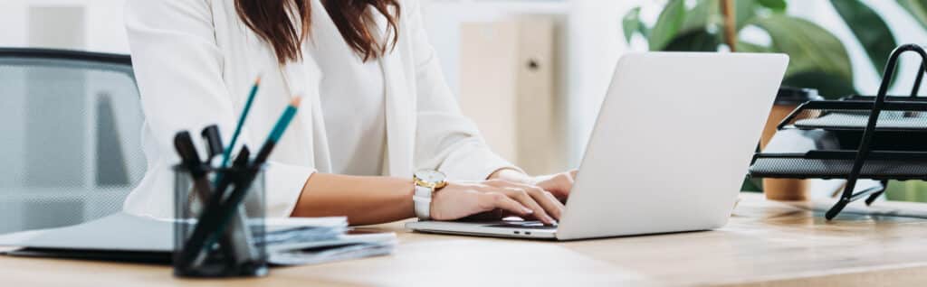 Woman typing on laptop