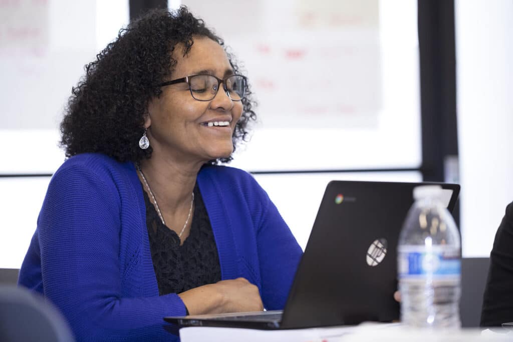 Woman looking at laptop