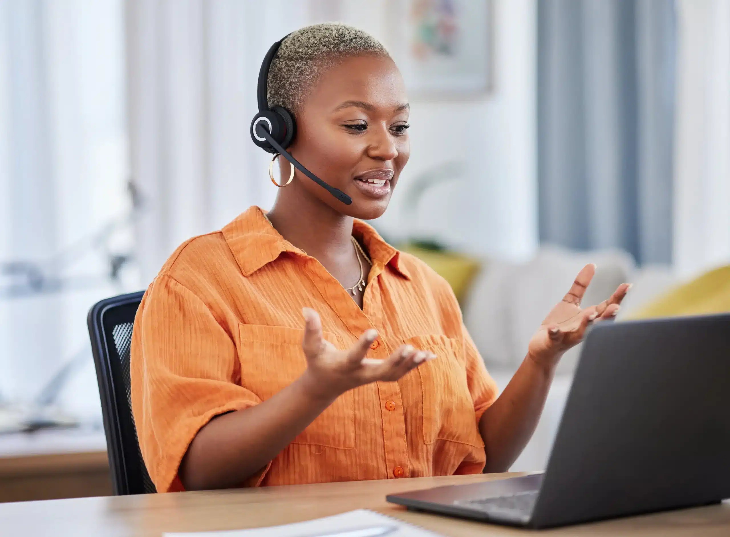 woman with headset and a laptop